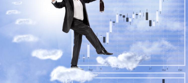 Business professional balancing the cloud.
