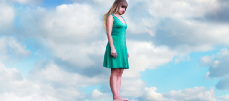 Woman standing on a cloud. 