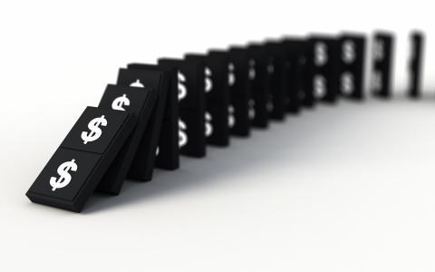Dominoes Falling with Money Signs