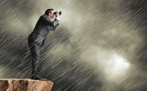 Professional in a rain storm taking pictures of clouds