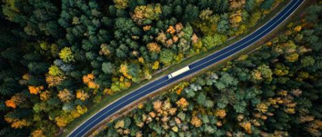 aerial shot with car on a highway