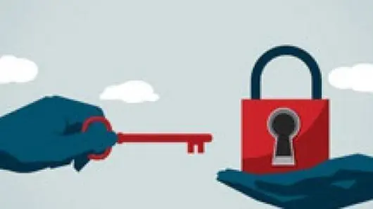 Person Holding a Lock and Key