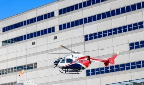 helicopter flying near a building