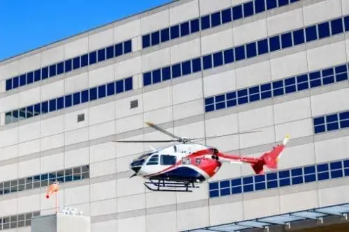 helicopter flying near a building