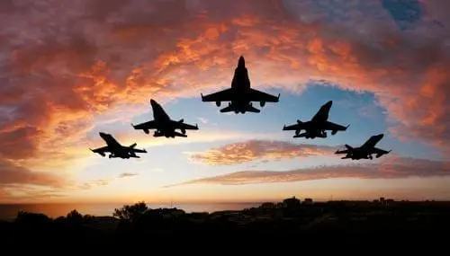 jets flying in formation during a sunset