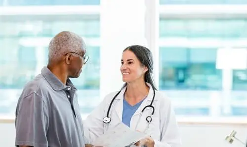 doctor speaking to patient