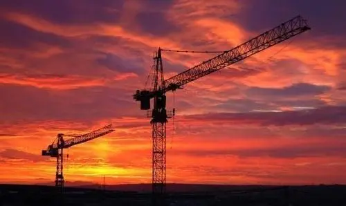 Two oil rigs at sunset
