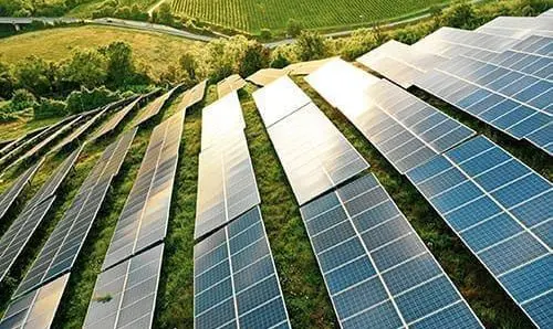 Solar panels fields on the green hills