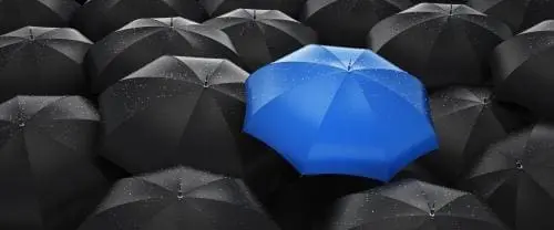illustration of black umbrellas and one blue umbrella