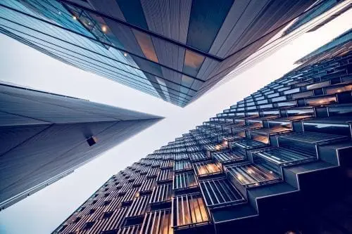 abstract image looking at the sky from between buildings