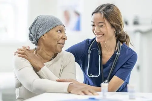 female medical professional assisting a patient