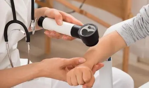 medical professional performing an exam on a child