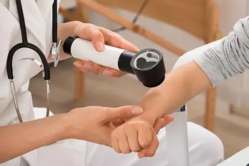 medical professional performing an exam on a child