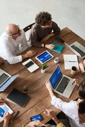 overhead view of office workers at a conference table