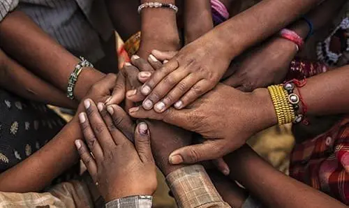 Children's hands in one of Indian villages showing unity.