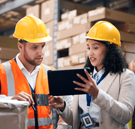 People working in warehouse on tablet