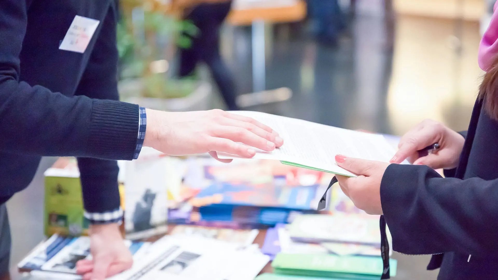 people exchanging documents