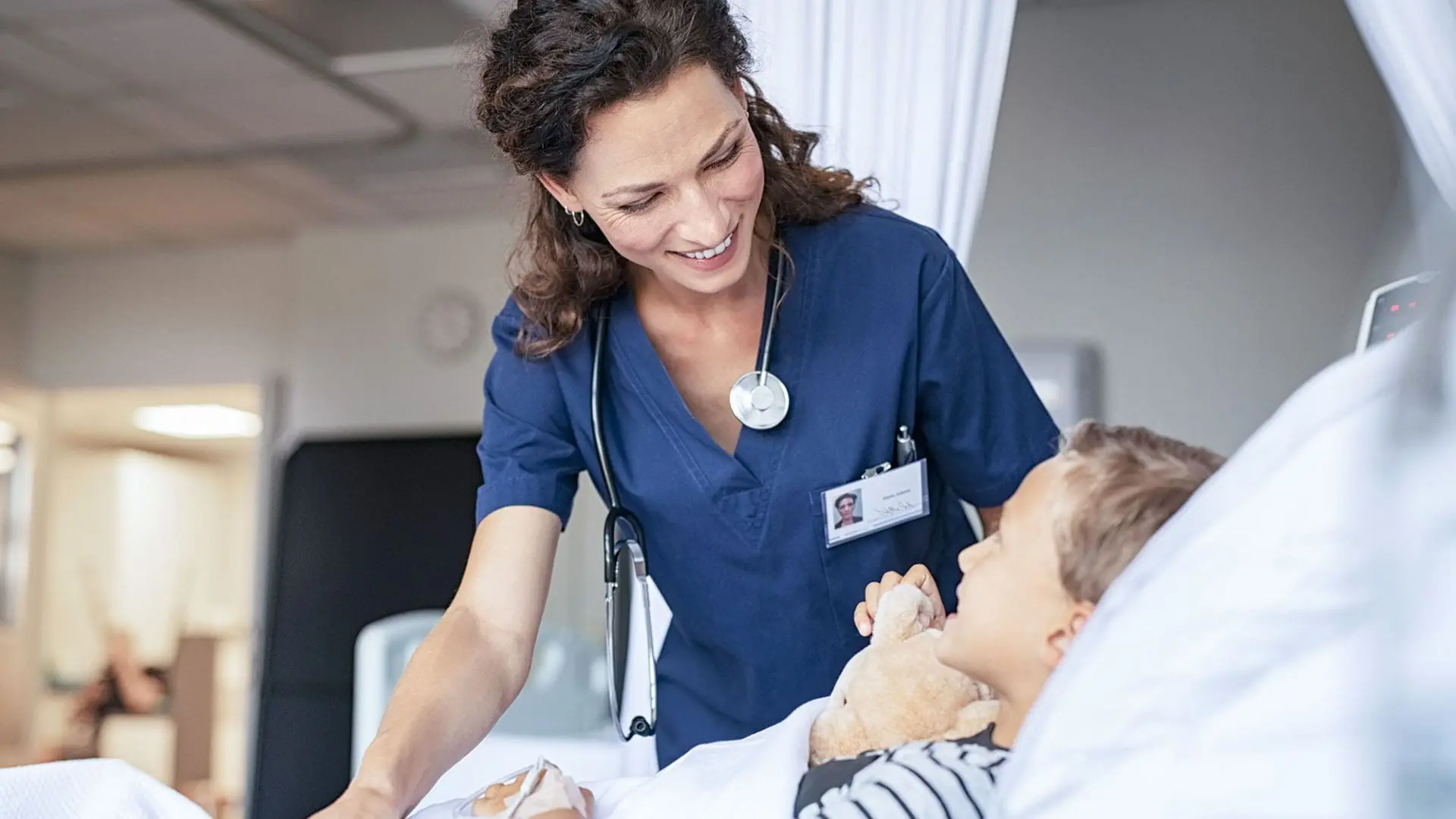nurse helping patient in hospital