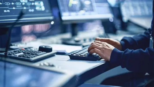 Close up image of a person using a computer