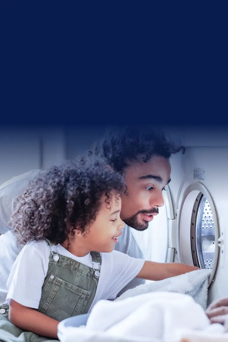 father and daughter doing laundry
