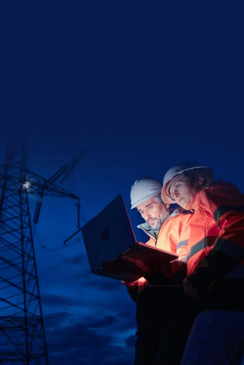 utility workers in front of powerline