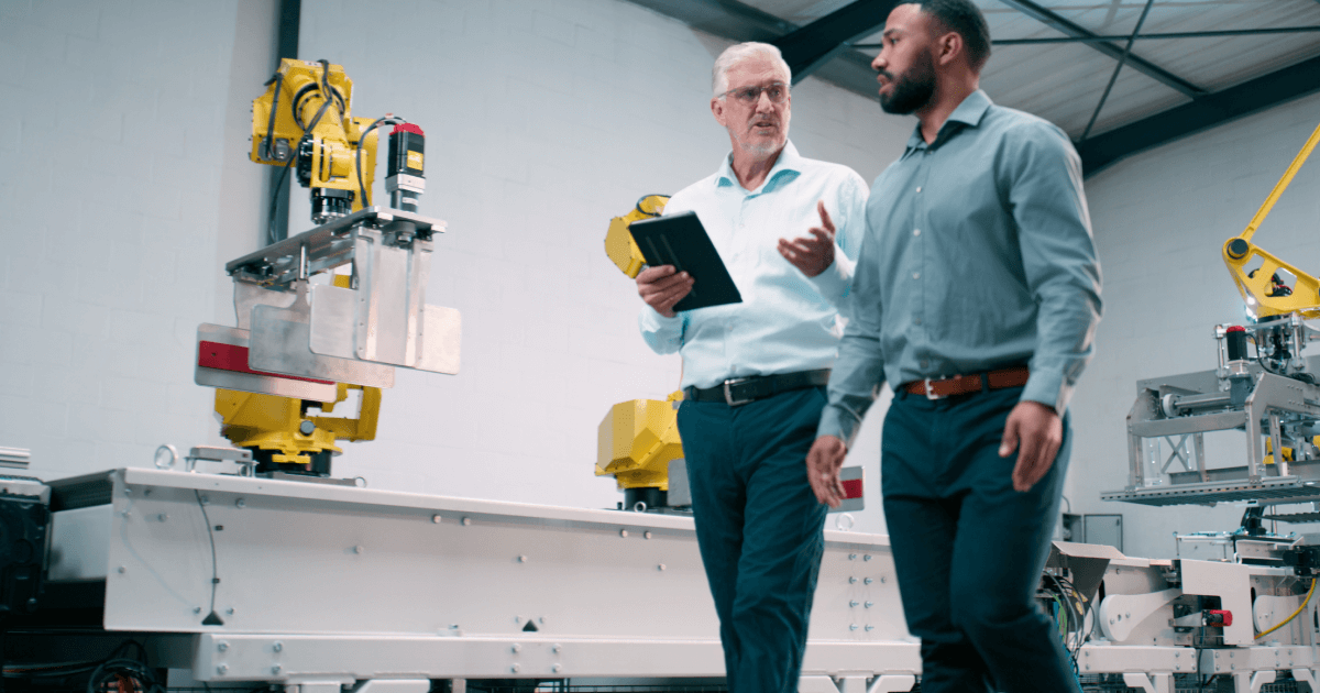 People talking in a manufacturing area