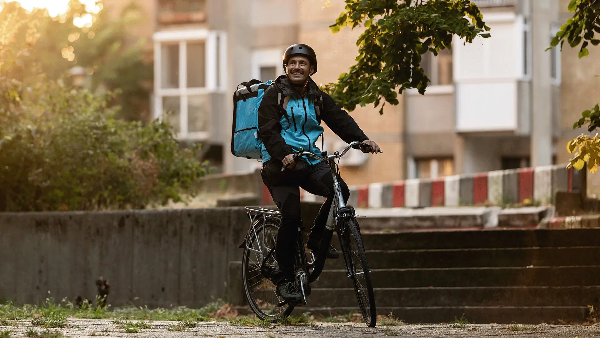 Deliveroo Featured Customer Image showing a delivery man on a bicycle